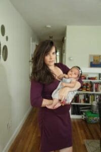 Phoebe cradles her daughter